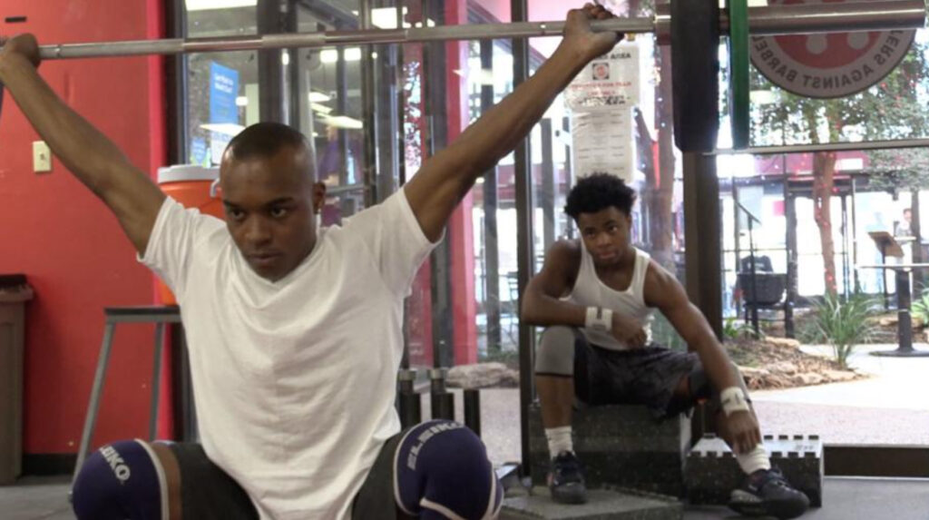 Two young men antwan and jerome lifting weights